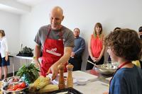 Marc Vetri works with a budding young chef.